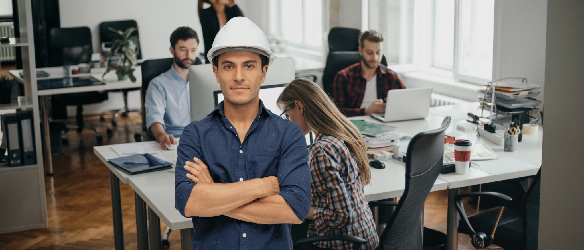 A hard hat wearing The Entrepreneurial CPA with a client office backdrop ready for an Experienced CPA Accounting Restructuring for efficiencies.